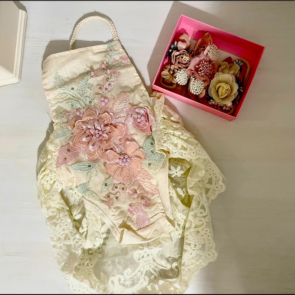 NEVER WORN linen onesie with floral detail and lace train.